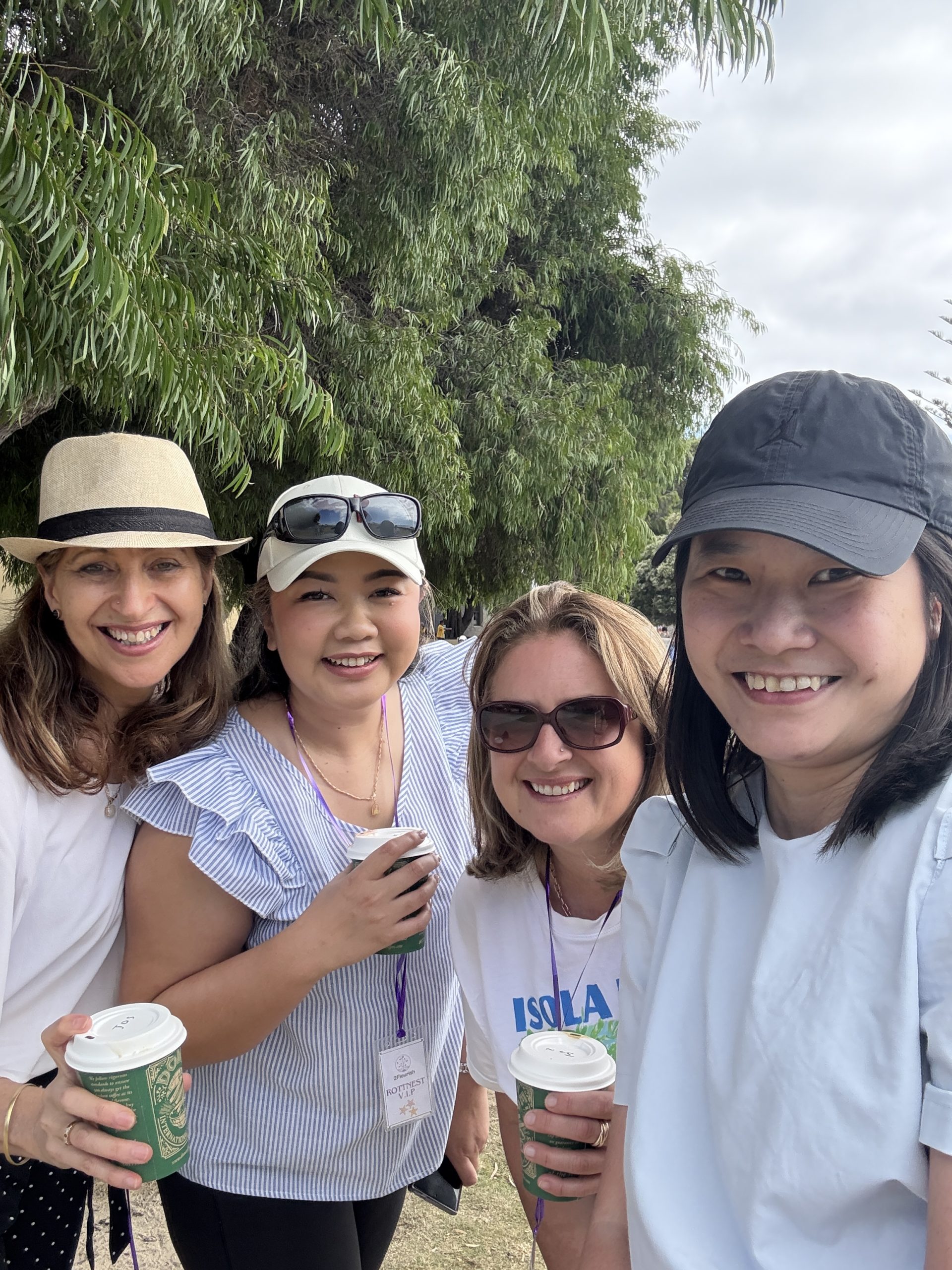 Group of friends enjoying coffee outdoors.